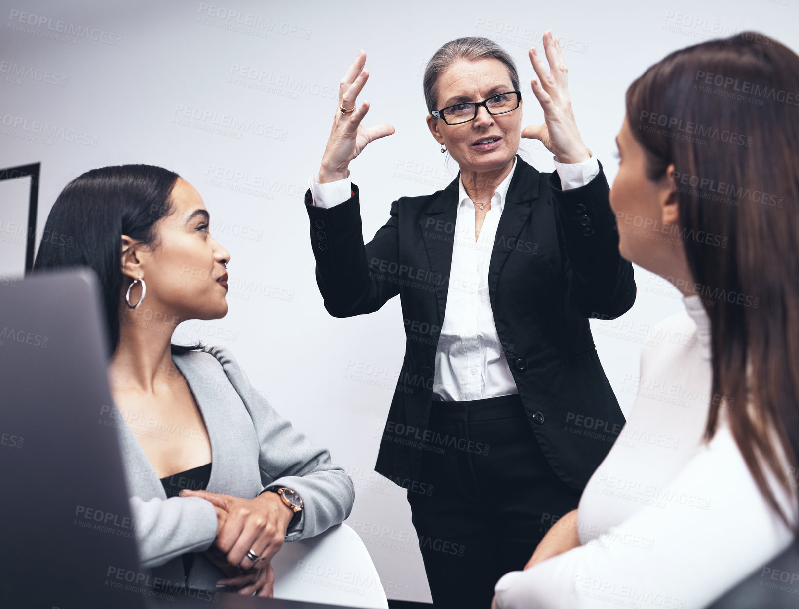 Buy stock photo Shot of a manager speaking to her staff