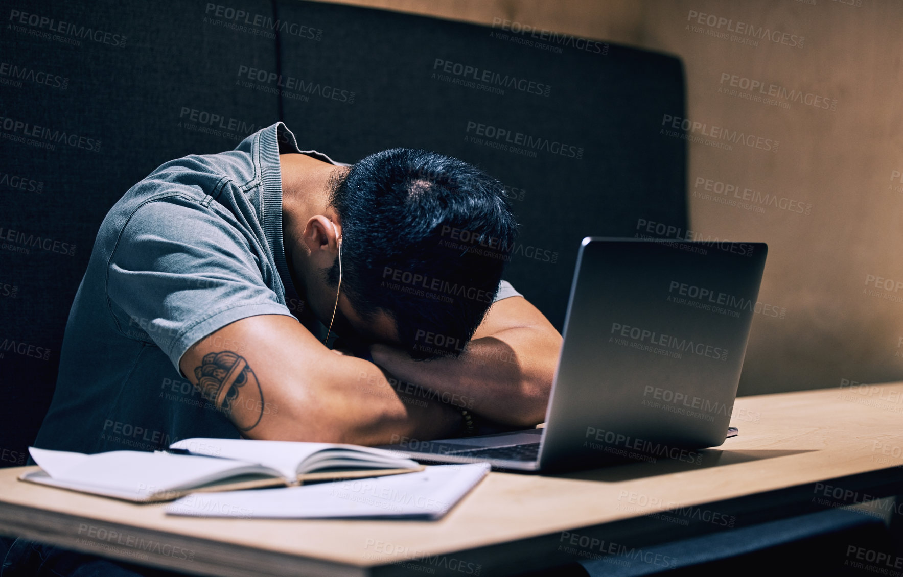 Buy stock photo Remote work, burnout and businessman sleep at cafe with laptop, book or 404 anxiety, glitch or connection fail. Night, restaurant and freelance writer with deadline anxiety, fatigue or article stress