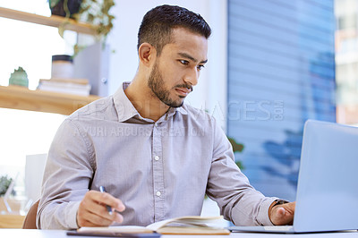 Buy stock photo Man, laptop and writing notes in office for ideas, reading or lead for story at media company. Staff writer, editor and employee by computer, notebook and scroll for research with info for newsletter