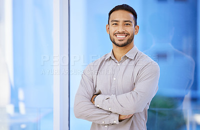 Buy stock photo Portrait of a confident young businessman standing in his office