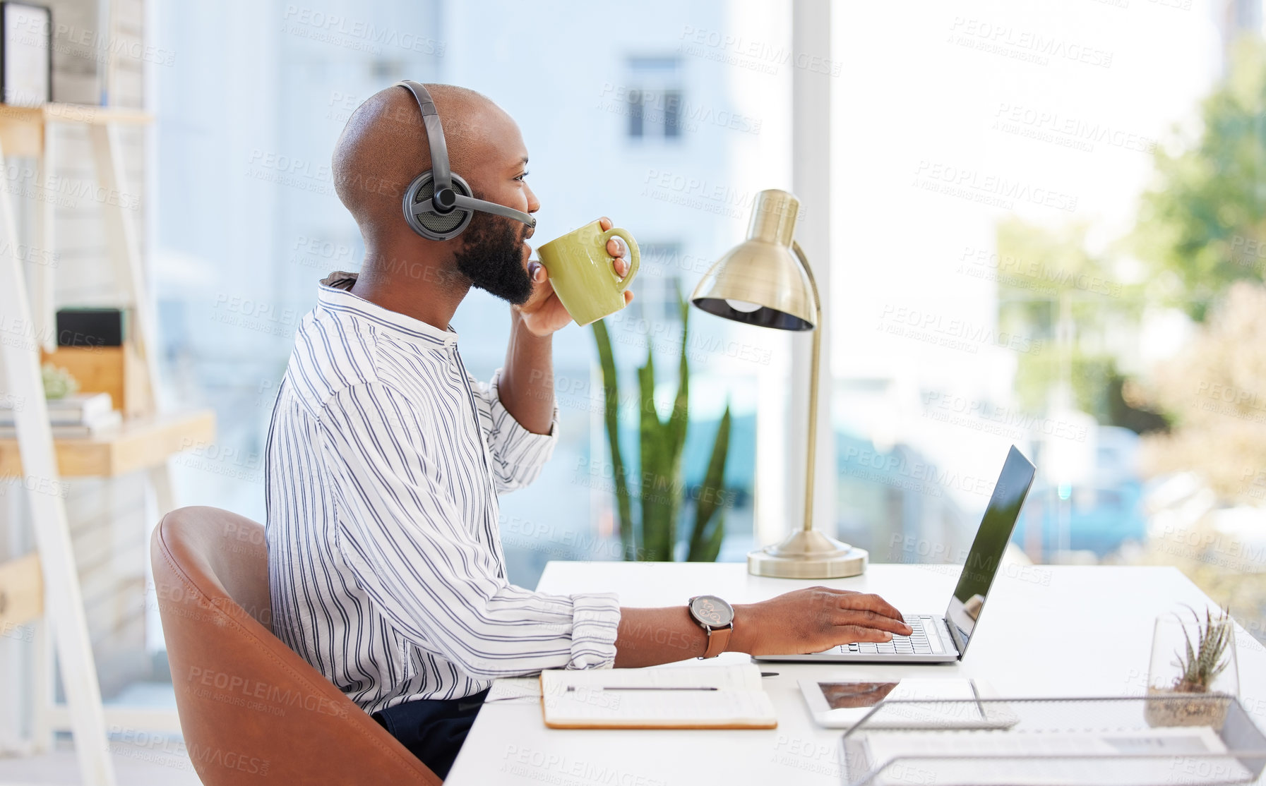 Buy stock photo Business, man and drinking coffee in call center office with headset, laptop and telemarketing break by desk. Consultant, african agent and relax from customer support, legal advice and communication