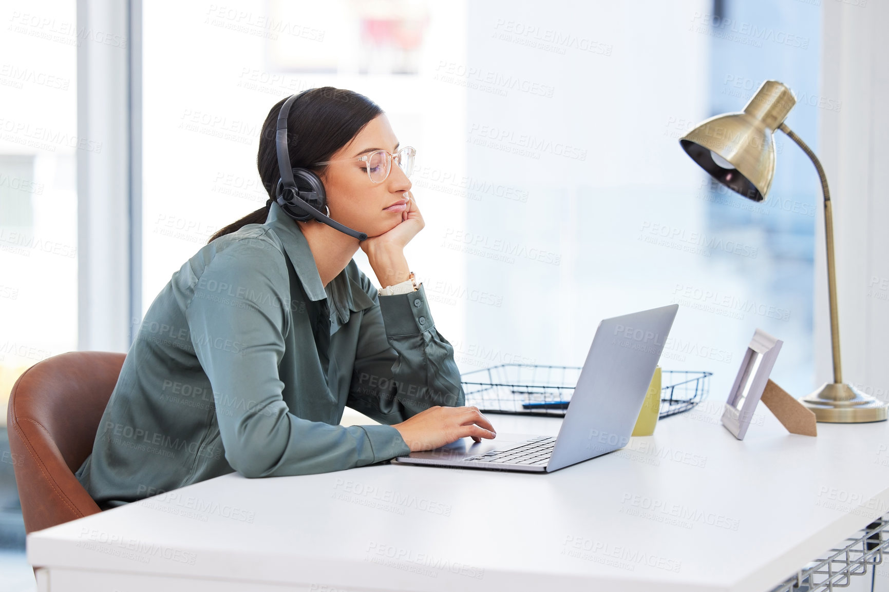 Buy stock photo Business, woman or tired in call center with laptop for customer support, internet glitch or depression. Telemarketing, consultant or bored with headset in office for brain fog, overworked or burnout