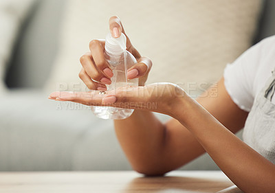 Buy stock photo Woman, hands and closeup of sanitizer for hygiene with spray bottle, bacteria and disinfection in home. Person, liquid cleaner and routine for germs, cleaning and health in living room or lounge