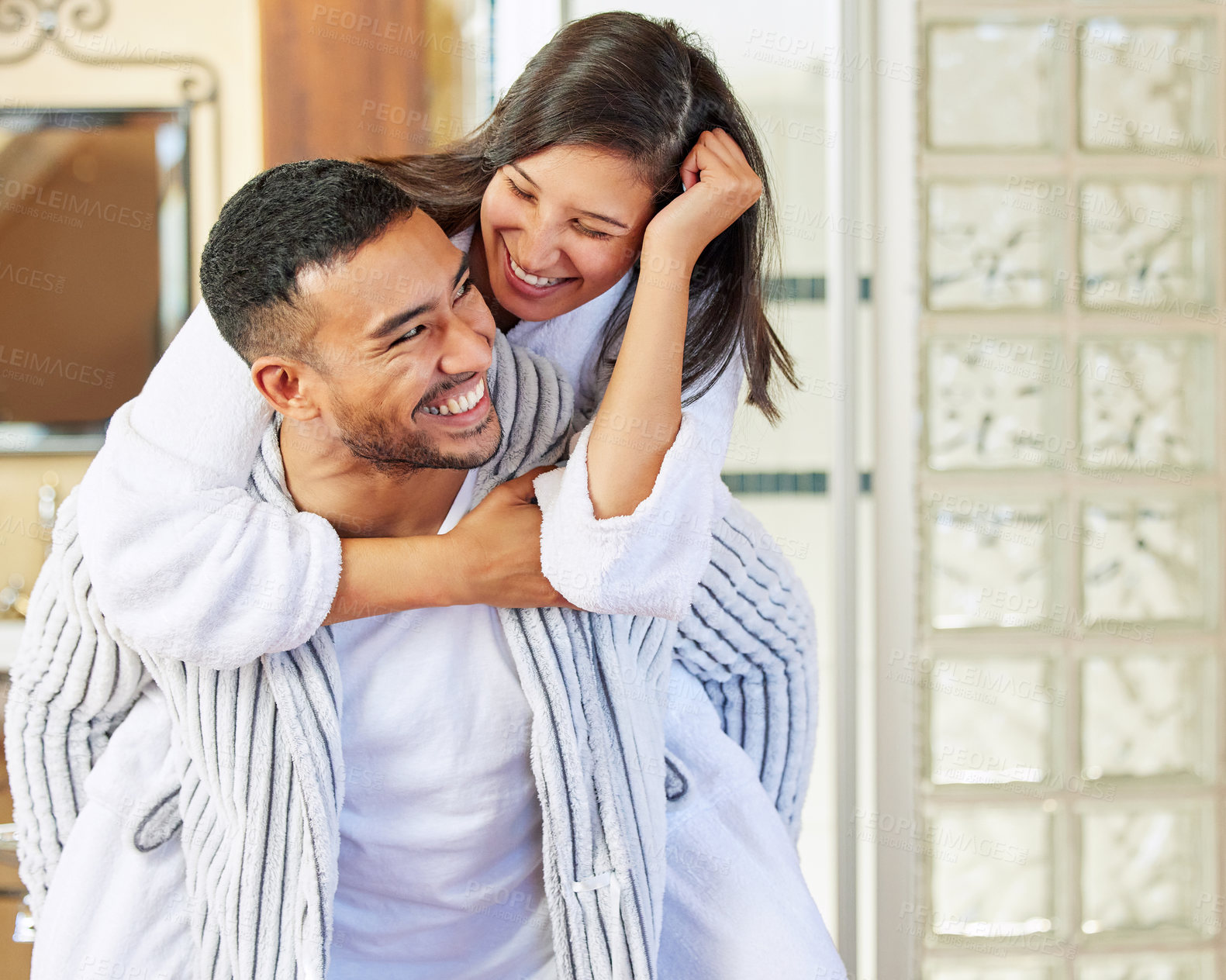 Buy stock photo Shot of a couple wearing pyjamas while spending quality time together at home