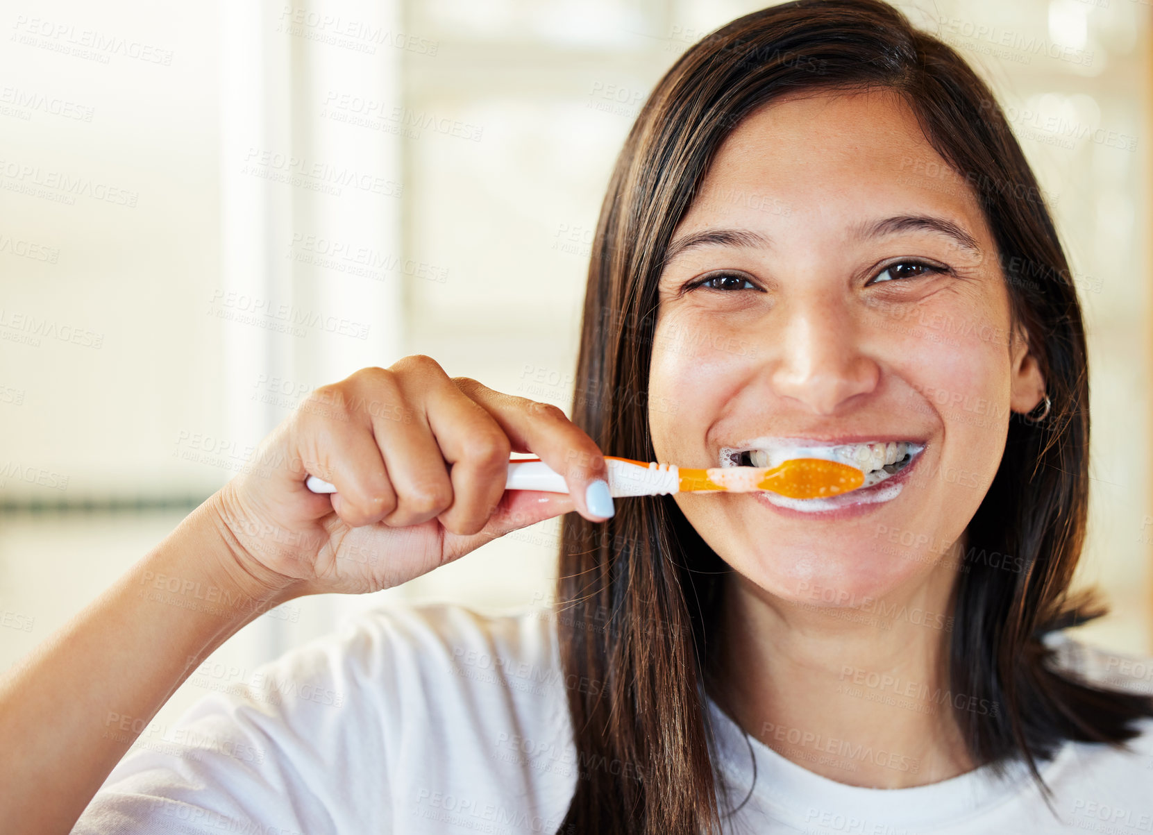Buy stock photo Closeup shot of a beautiful young woman brushing her teeth