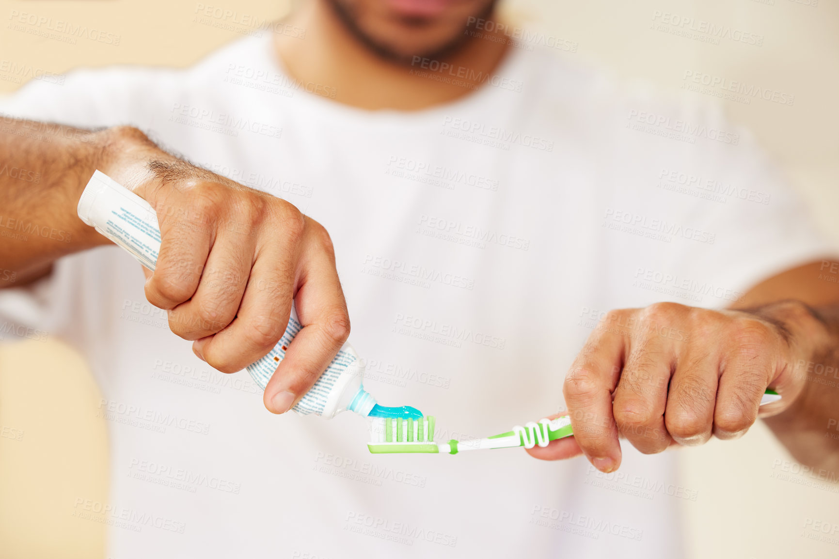 Buy stock photo Cropped shot of a man putting toothpaste on his toothbrush