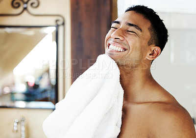 Buy stock photo Shot of a man drying his face after shaving
