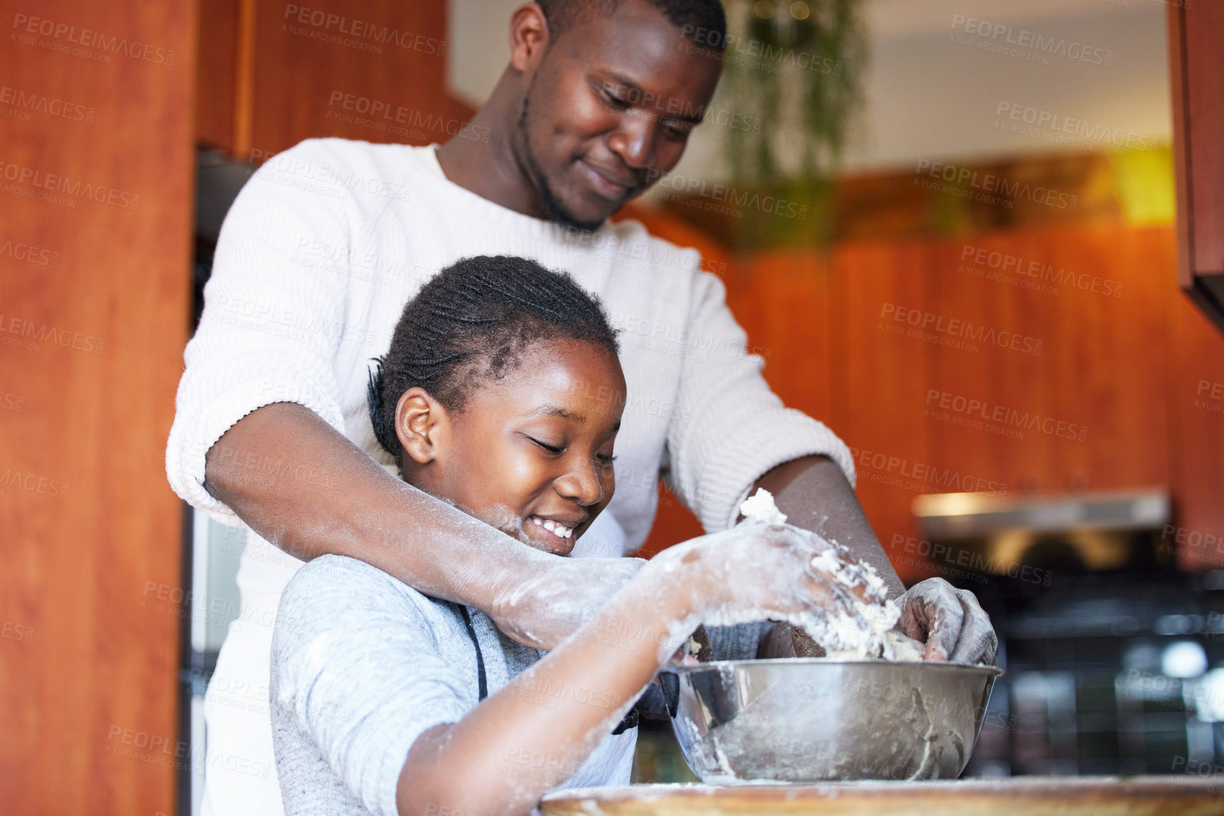 Buy stock photo Black family, father and daughter with baking in kitchen for learning, support and happy with helping. Dad, girl child and cooking with wheat, dough and smile in home for bonding, love or weekend fun