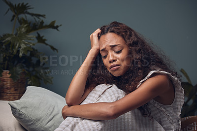 Buy stock photo Stress, girl and depressed with headache in home for burnout or grief with anxiety and unhappy. Black woman, alone and crying on sofa in house for heartbreak or breakup, lonely and mental health.