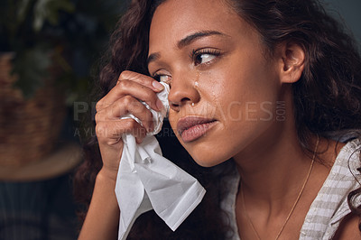 Buy stock photo Sadness, girl and depressed with tissue in home for grief or crying with memory and unhappy. Woman, emotional and tears for sorrow in house for heartbreak or breakup, lonely and mental health.