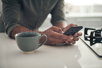Buy stock photo Hands, coffee and man with smartphone in kitchen for trending updates or popular topics on social media or internet. Person, home and texting for messaging or connection, streaming and download.