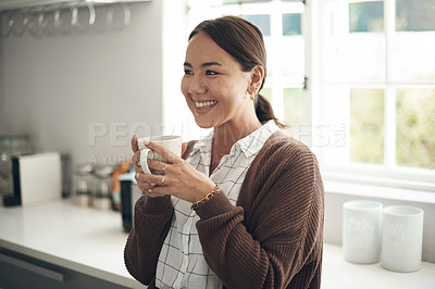 Buy stock photo Woman, coffee and thinking with smile in kitchen for morning routine, holiday and winter vacation. Asian person, happy and hand with mug for warm beverage, satisfaction and weekend enjoyment at home