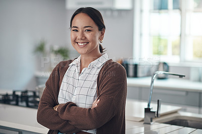 Buy stock photo Asian woman, smile and arms crossed, excited for real estate or purchasing house with kitchen in portrait. Korean, female person and happiness for homeowner with renovated apartment to relax and rest