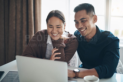 Buy stock photo Couple, laptop and smile with finance in kitchen for credit score, investment saving and mortgage payment. Budget, asian people and happy with tech for debt review, insurance policy or tax documents 
