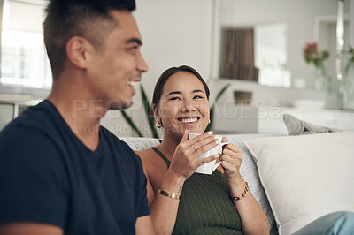 Buy stock photo Relax, smile and couple on sofa with coffee, bonding and happy relationship together in home on weekend. Morning drink, man and woman on couch with tea laughing, talking and love in calm apartment.