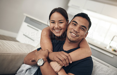 Buy stock photo Portrait, smile and Asian couple in home to relax for love, care and hug on sofa in living room. Face, happy man and woman in lounge for connection, support or commitment for healthy relationship