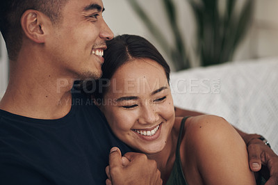 Buy stock photo Couple, hug and laugh on sofa for bonding, humor and romance on home date and funny joke for comedy. People, holding hands and love in embrace for marriage, support and trust in connection or comfort