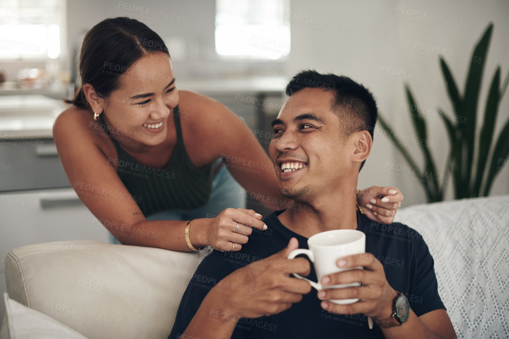 Buy stock photo Relax, smile and couple on couch with coffee, bonding and happy relationship together in home on weekend. Morning drink, man and woman on cozy sofa with laughing, talking and love in calm apartment.