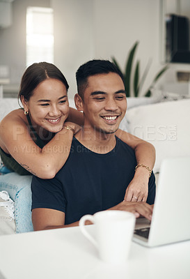 Buy stock photo Smile, couple and remote work on laptop in home office for social media or communication. House, happy man and woman on computer at table on internet, website and freelancer embrace for love together