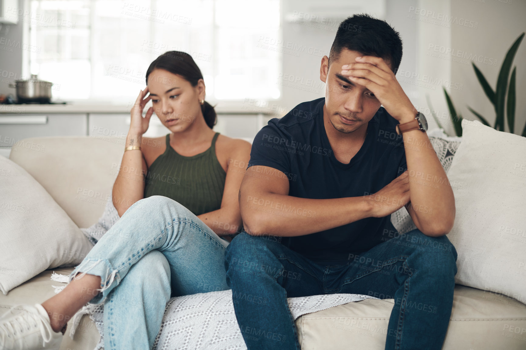 Buy stock photo Divorce, stress or couple fight on sofa with headache, anxiety or frustrated by liar, fail or drama at home. Marriage, conflict or asian people argue in living room with fear, overthinking or mistake