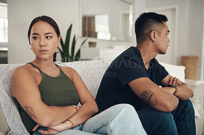 Buy stock photo Divorce, fight or arms crossed couple on sofa for anxiety, fear or frustrated by liar, stress or drama at home. Marriage, conflict or asian people argue in living room with blame, regret or mistake