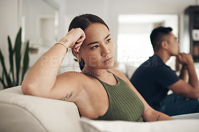 Buy stock photo Frustrated couple, headache and ignore with fight on sofa for breakup, conflict or disagreement in living room at home. Upset or young woman and man in divorce, separation or argument at the house