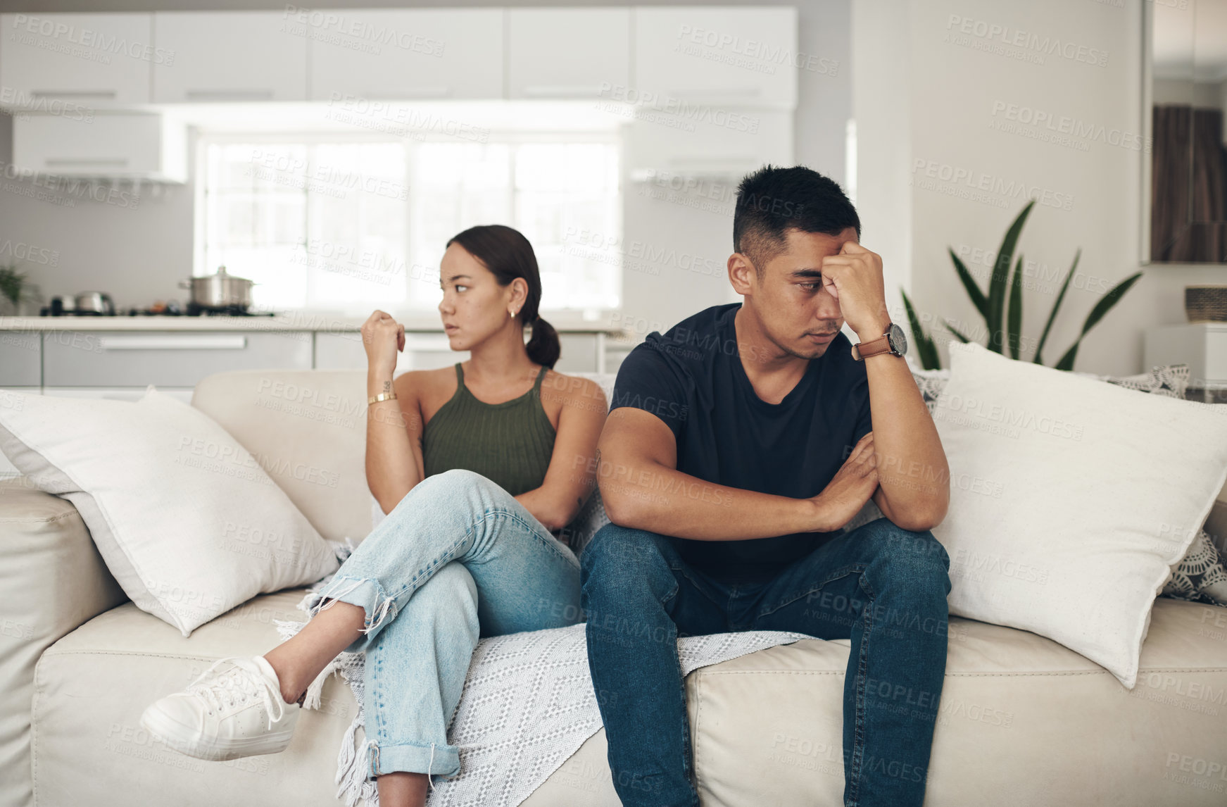 Buy stock photo Divorce, angry or couple fight on sofa with anxiety, fear or frustrated by liar, stress or drama at home. Marriage, conflict or asian people argue in living room with blame, overthinking or mistake