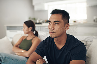 Buy stock photo Frustrated couple, ignore and fight with argument on sofa for breakup, conflict or disagreement in living room at home. Upset or young woman and man in divorce, separation or dispute at the house