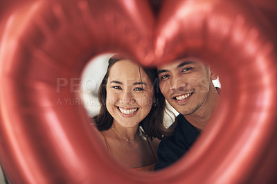 Buy stock photo Valentines day, heart balloon and interracial couple portrait with love, happiness and care. Red balloons, present and romance of a happy Asian woman and man together with a smile on a date