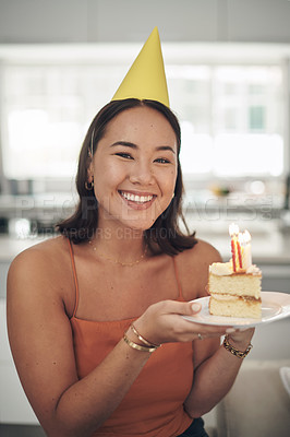 Buy stock photo Birthday, portrait and woman with a cake and party hat for a celebration in the living room of her home. Happy, smile and excited Asian female holding a dessert with candles to celebrate in a house.