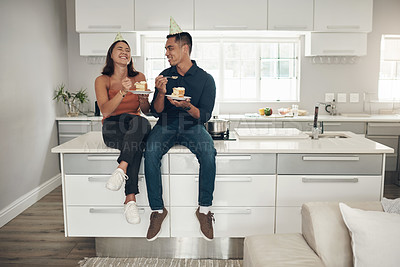 Buy stock photo Couple, birthday cake and celebration in a home kitchen with happy people and food. Celebrate, table sitting and laughing of a woman and man together with love and care with dessert for party