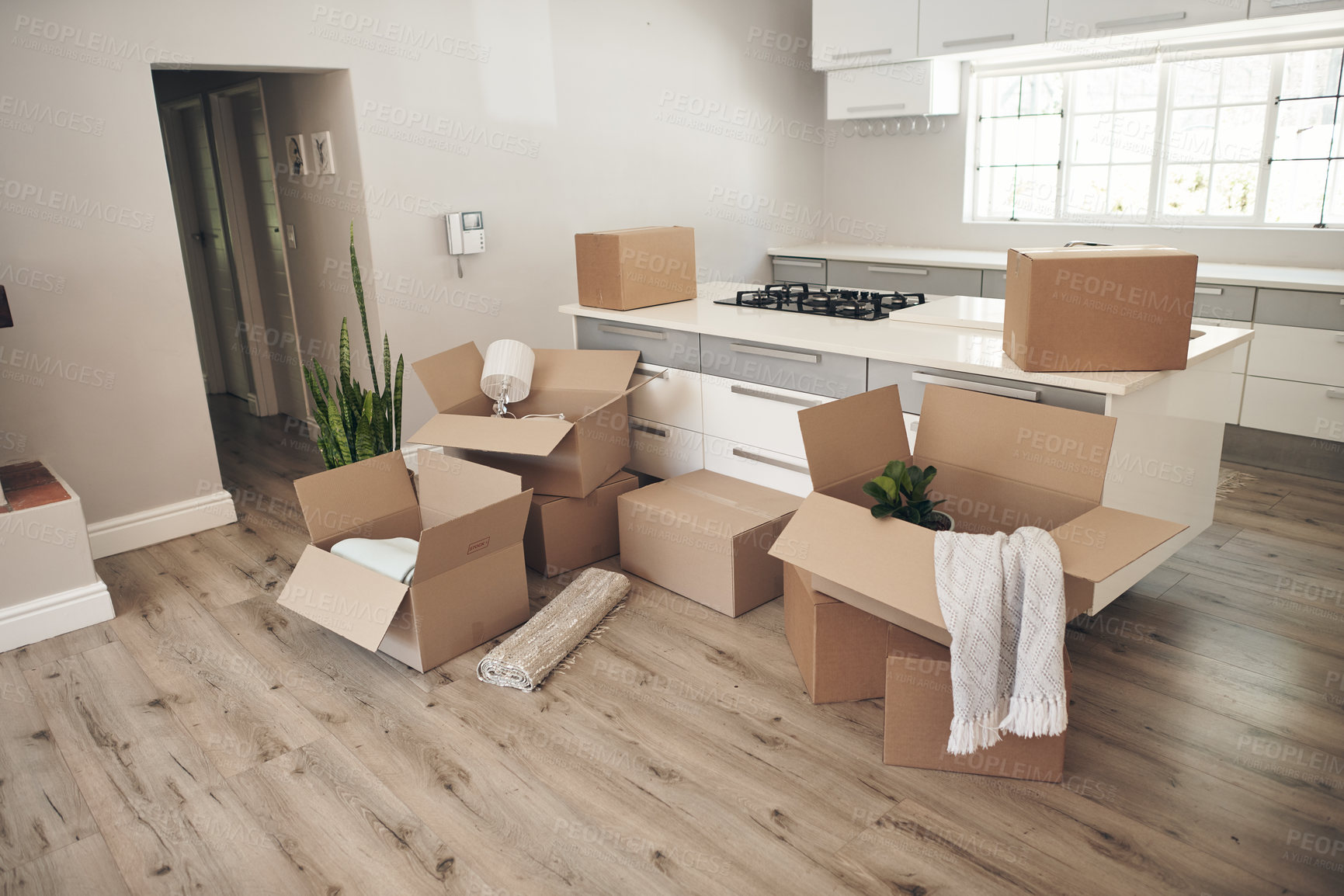 Buy stock photo Room, boxes and relocation for moving, apartment and new home with belongings, unpack and no people. Cardboard, mortgage and property for real estate, packaging and kitchen counter in modern house