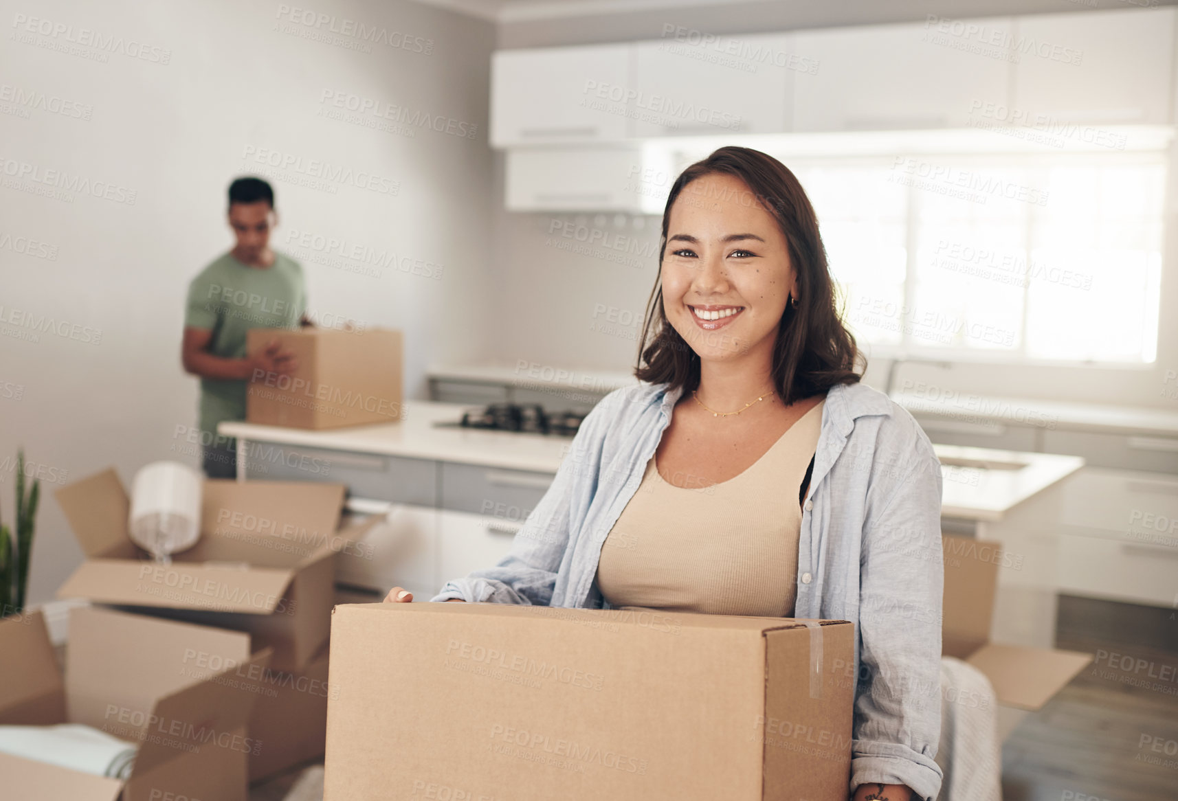 Buy stock photo Happy woman, moving and carry box in new house for property, investment and real estate in living room. Female homeowner, smile and joy in apartment for immigration and relocate or home purchase