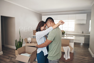 Buy stock photo Young couple, hug and moving to new home with boxes for renovation, investment or relocation. Happy, man and woman embrace in living room for apartment decoration, property rent and mortgage loan