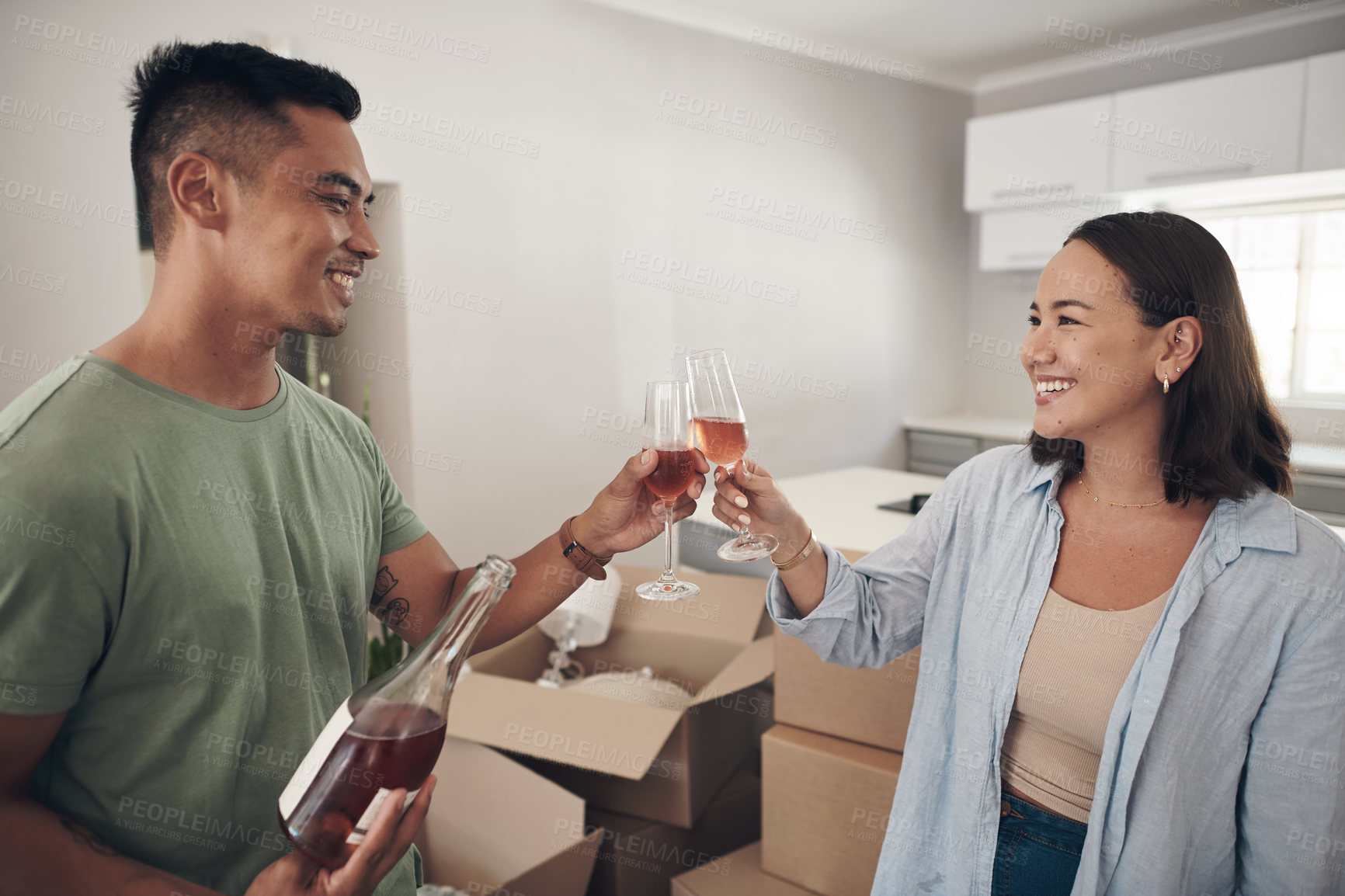 Buy stock photo Wine, toast and happy couple with new house celebration for moving, start or real estate investment success. Property, growth or people in dream home with glass cheers for mortgage, loan or milestone
