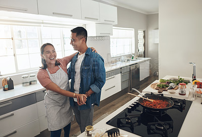 Buy stock photo Dancing, cooking and couple in kitchen together with healthy food, relationship and bonding in home. Romance, happy man and woman in apartment with nutrition, care and meal prep with love for lunch