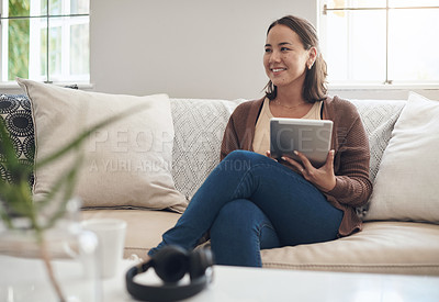 Buy stock photo Woman, home and sofa with thinking on tablet for social media post and entertainment in living room. Female person, internet and streaming service or website for news update or online search
