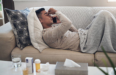 Buy stock photo Sick, man and phone call with headache for help, advice or conversation with sinus, flu or illness on sofa at home. Tired male person talking on mobile smartphone with fever, influenza or infection