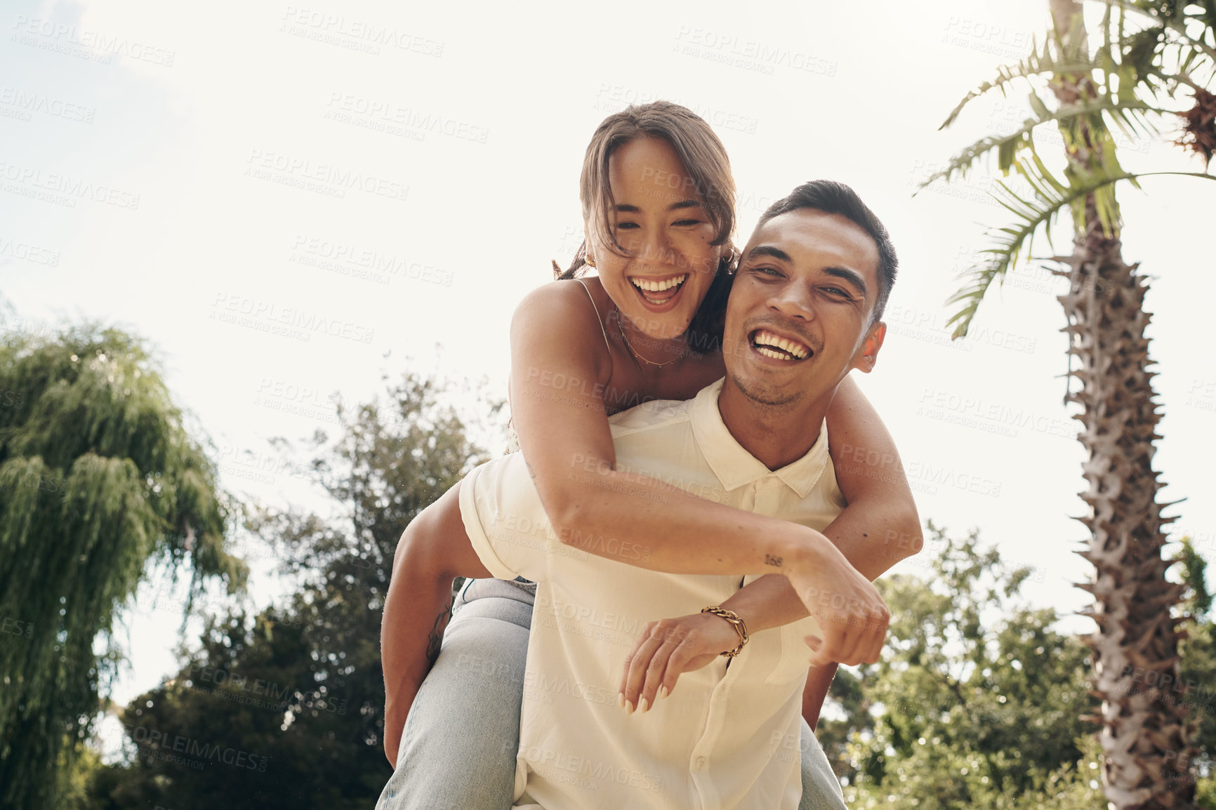Buy stock photo Happiness, couple and piggyback in garden for love, summer and having fun together outdoor. Relationship, smile and partnership on weekend for support, man and woman in springtime for holiday