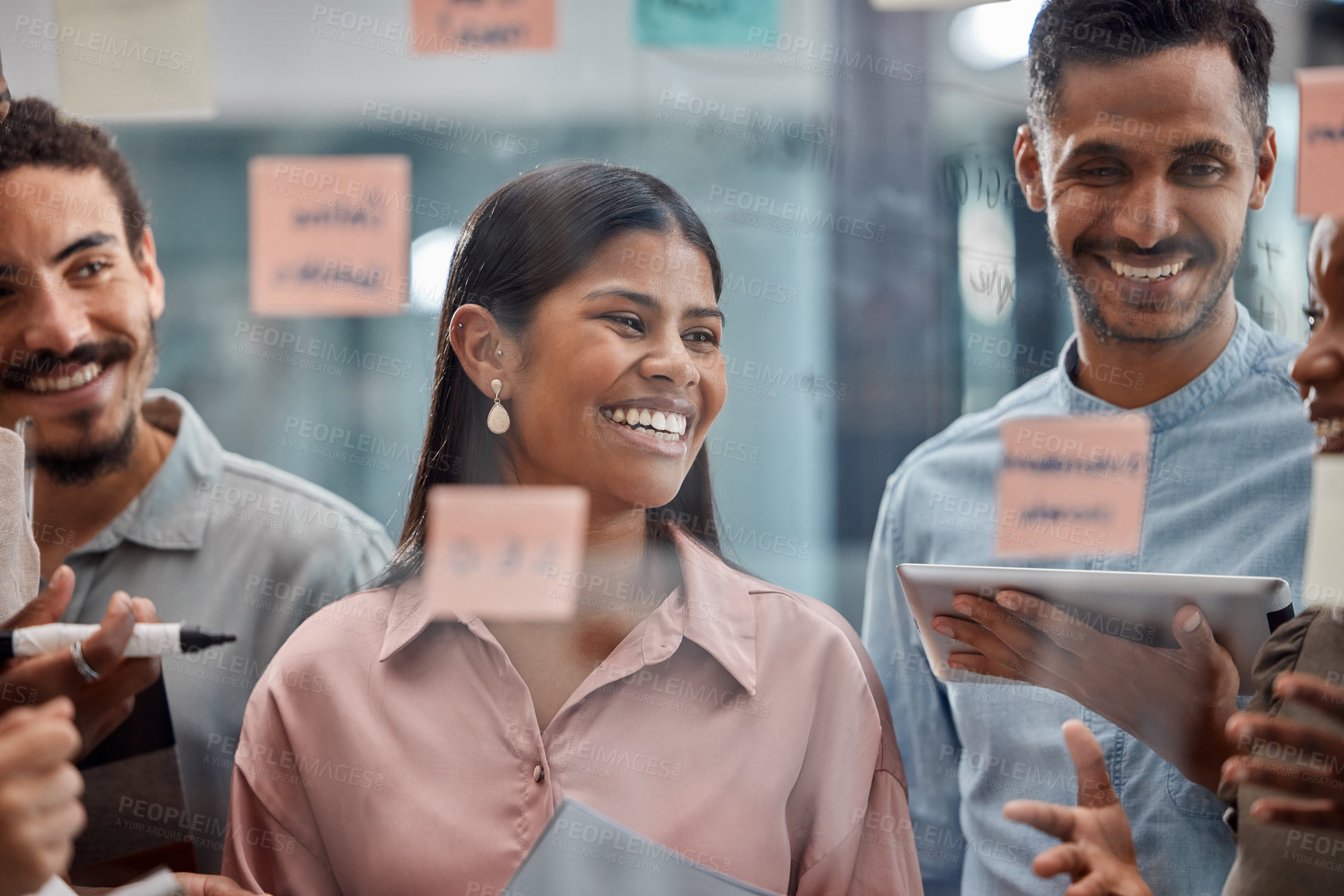 Buy stock photo Happy people, creative and planning with meeting for discussion, brainstorming or team building at office. Young group of employees with smile for startup, collaboration or presentation at workplace