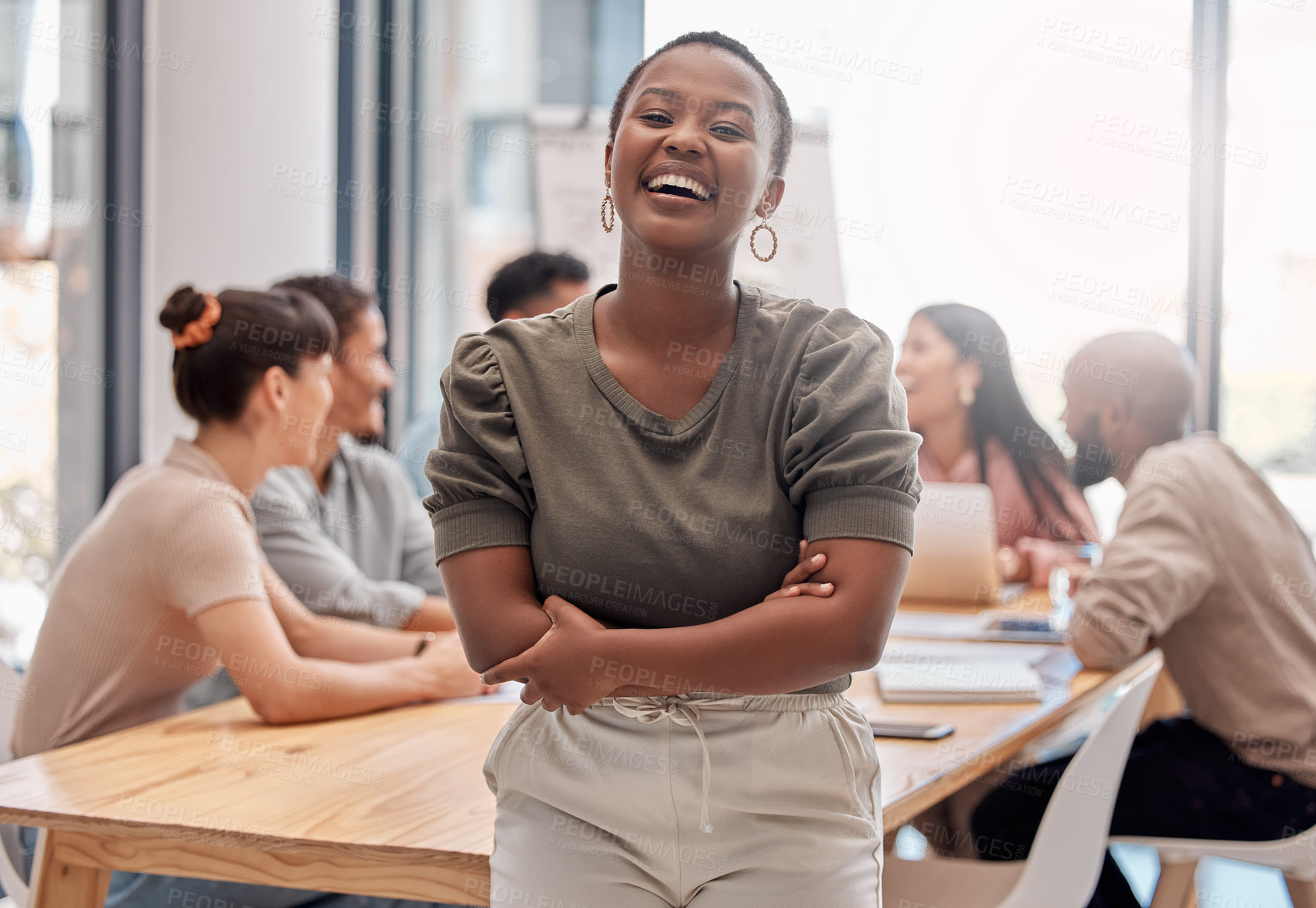Buy stock photo Portrait, smile and black woman with arms crossed, startup success and teamwork in a modern office. Face, female person or leader with staff, manager or happiness with humor, meeting and professional