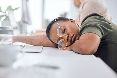 Buy stock photo Black woman, sleep and tired in office on table with glasses, exhausted and overtime or deadline. Female employee, business and fatigue from administration work with nap, burnout and overwork
