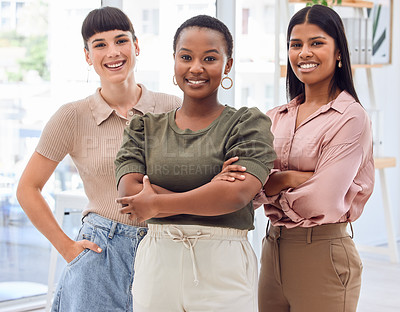 Buy stock photo Shot of three businesswomen standing together in an office