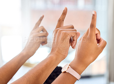 Buy stock photo Cropped shot of a group of people raising their hands during a presentation
