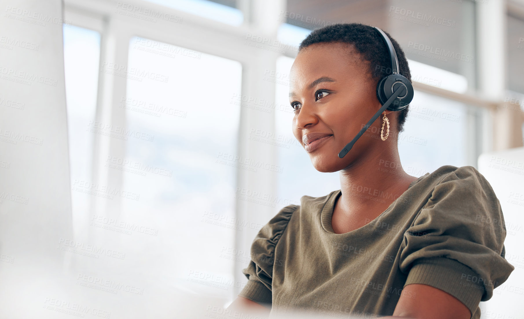 Buy stock photo Shot of a woman wearing a headset while working in a call centre