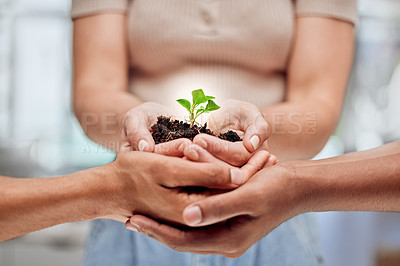 Buy stock photo Shot of a group of unrecognizable people holding plants growing out of soil