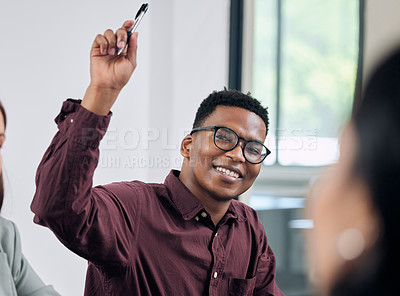 Buy stock photo Shot of a young businessman with his hand raised in question