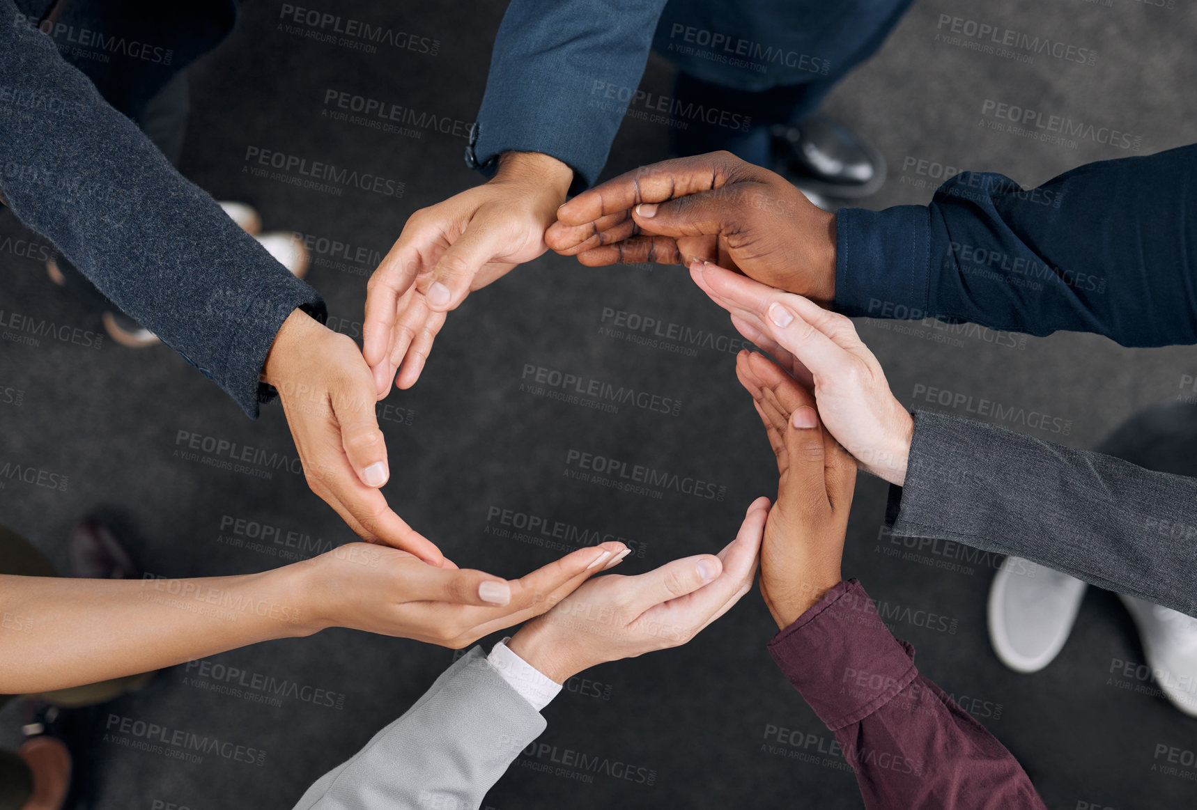 Buy stock photo Shot of a group of businesspeople with their hands joined together to form a circle