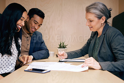 Buy stock photo Meeting, finance advisor and couple with documents for life insurance, mortgage investment and loan application. Financial, consultant and man and women with paperwork for planning, deal and contract