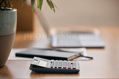 Buy stock photo Still life shot of a calculator on a desk in an office